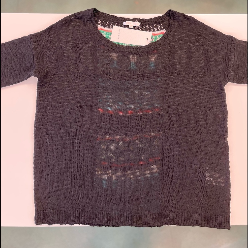 see U soon brand sweater. Black with colorful back panel.